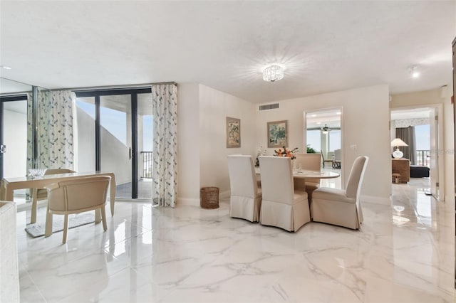 dining room with visible vents, marble finish floor, and baseboards