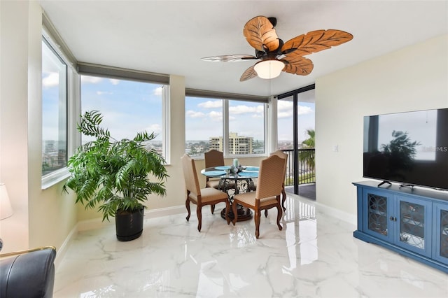 sunroom with ceiling fan