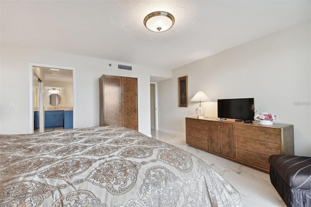 bedroom featuring visible vents, marble finish floor, and ensuite bath