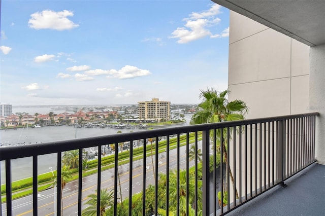 balcony featuring a view of city and a water view