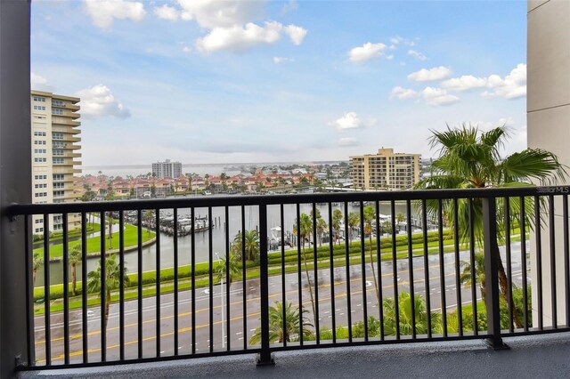 balcony with a view of city and a water view