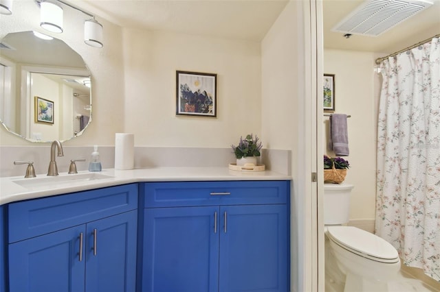 bathroom with visible vents, toilet, vanity, and a shower with curtain