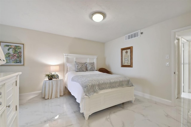 bedroom featuring baseboards, visible vents, and marble finish floor