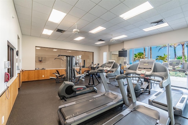 exercise room featuring visible vents and a drop ceiling