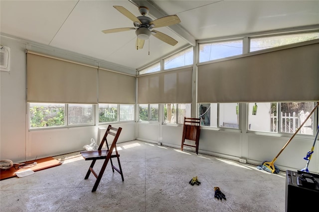 unfurnished sunroom featuring lofted ceiling with beams and a ceiling fan