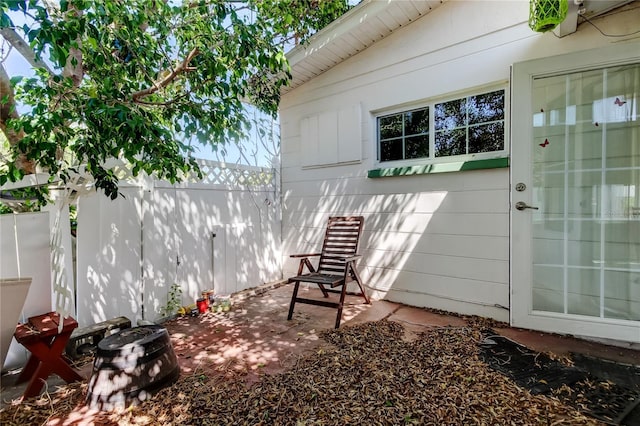 exterior space featuring a patio area and fence