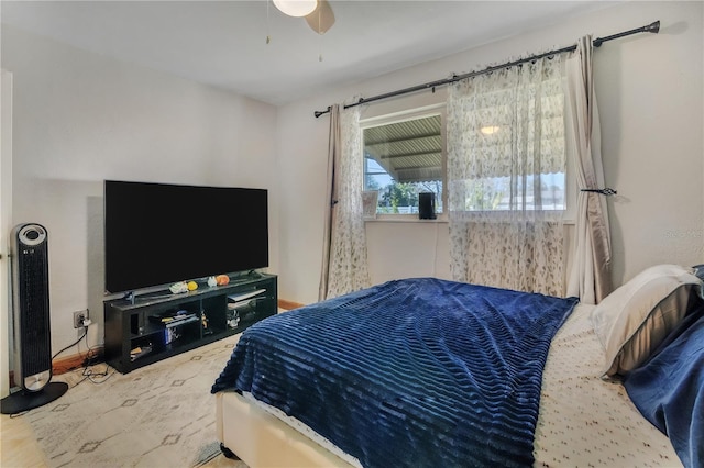 bedroom with baseboards and a ceiling fan