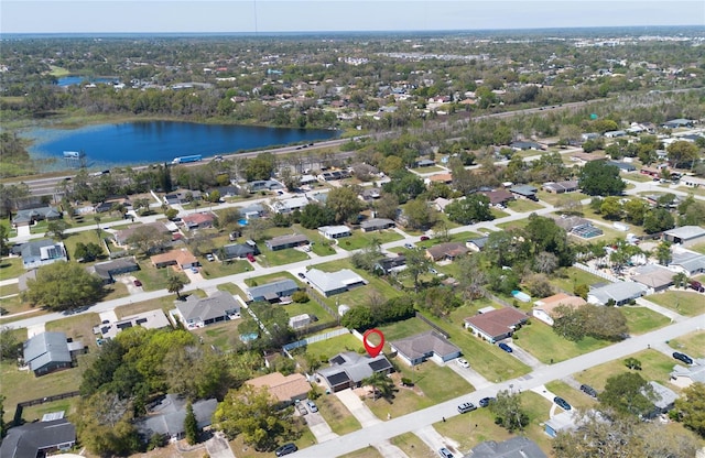 bird's eye view featuring a water view and a residential view