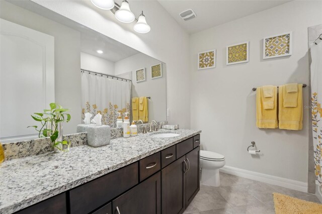 full bath with visible vents, baseboards, toilet, tile patterned floors, and vanity