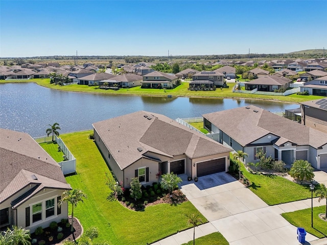 birds eye view of property featuring a residential view and a water view