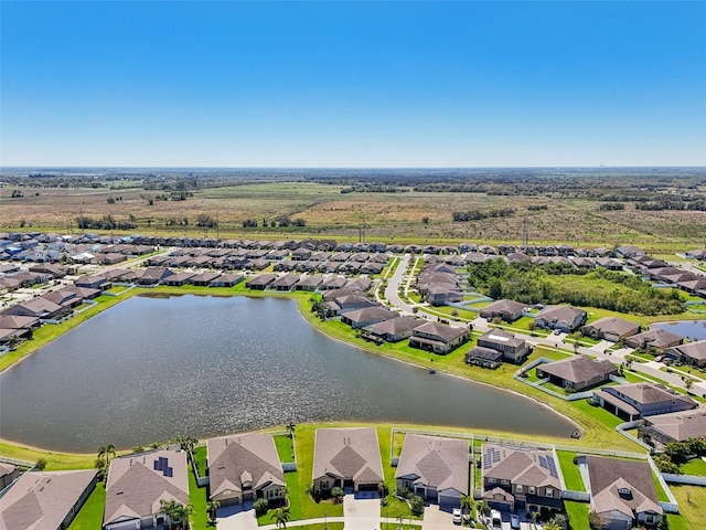 bird's eye view featuring a residential view and a water view