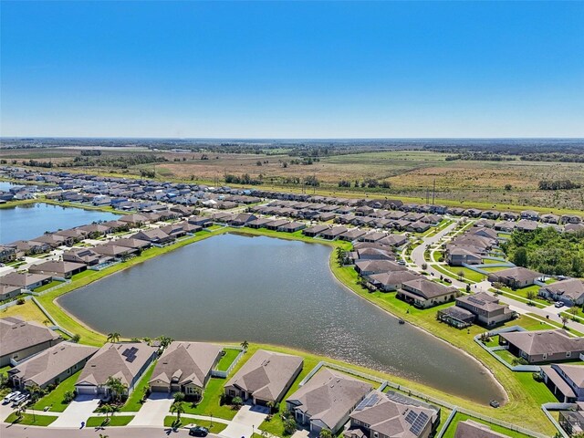 birds eye view of property featuring a residential view and a water view