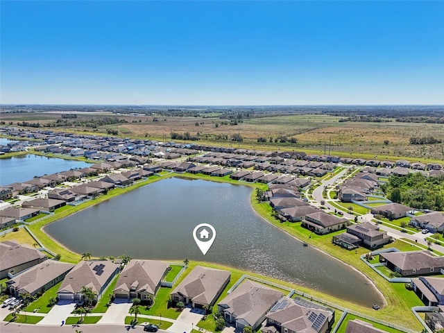 bird's eye view with a residential view and a water view