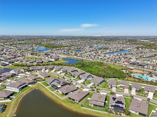 bird's eye view featuring a residential view and a water view