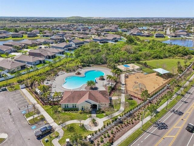 birds eye view of property featuring a residential view and a water view