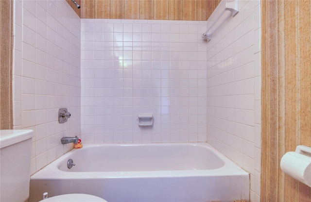 bathroom featuring wallpapered walls and toilet