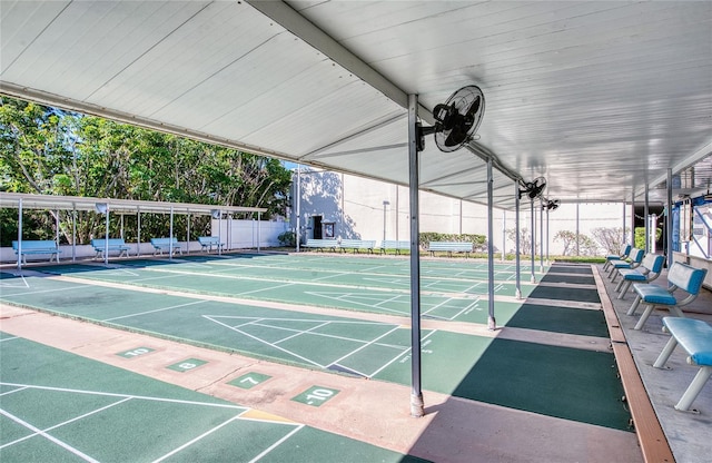 surrounding community featuring shuffleboard and fence