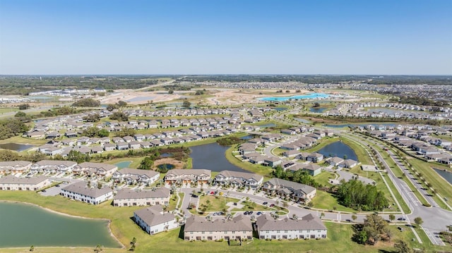 aerial view with a residential view and a water view