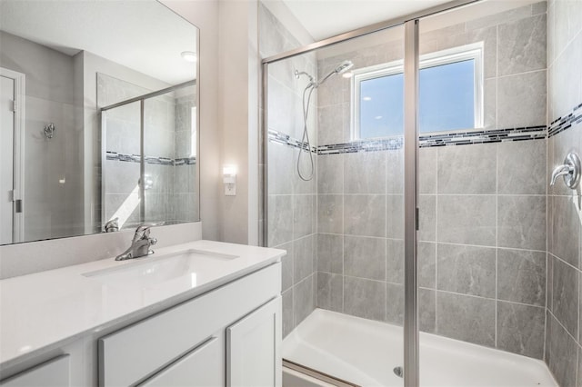 full bathroom featuring a shower stall and vanity