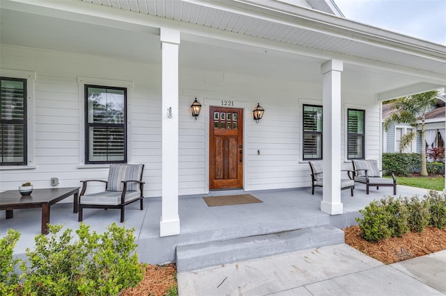 doorway to property with covered porch