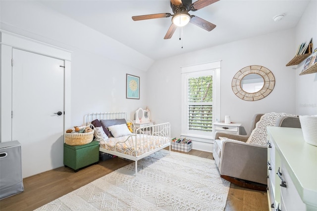 bedroom featuring lofted ceiling, ceiling fan, and wood finished floors