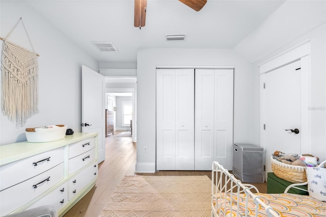 bedroom with visible vents, a closet, ceiling fan, and light wood finished floors