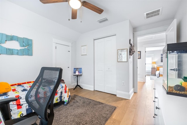 interior space featuring ceiling fan, baseboards, visible vents, and light wood-type flooring