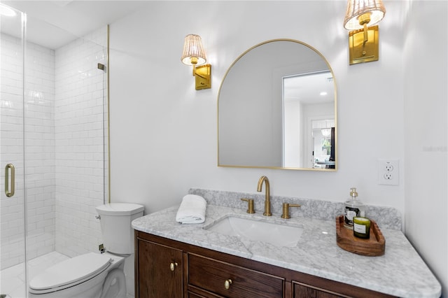 full bath featuring a shower stall, toilet, and vanity