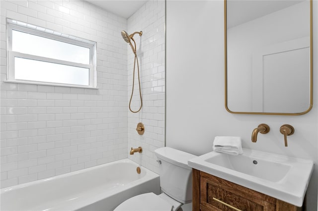 bathroom featuring vanity, toilet, and washtub / shower combination