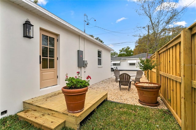 view of yard featuring fence and an outdoor fire pit