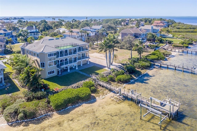 bird's eye view with a residential view and a water view