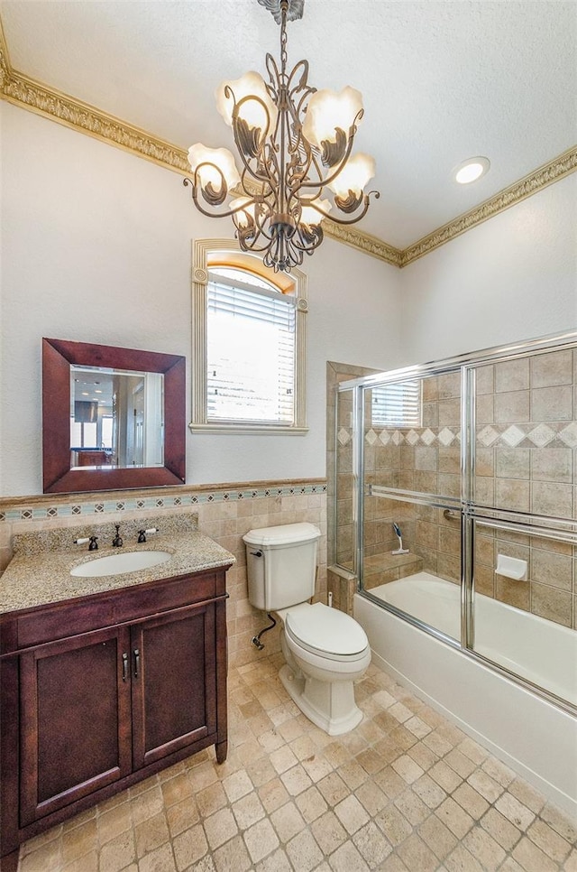 full bathroom featuring plenty of natural light, toilet, tile walls, and vanity