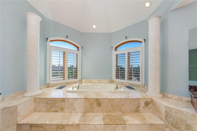 full bath featuring a bath and ornate columns