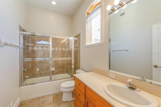 full bathroom featuring bath / shower combo with glass door, toilet, and vanity