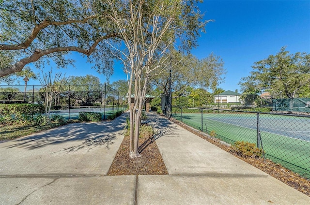 view of sport court with fence