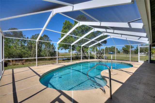 pool with a lanai and a patio area