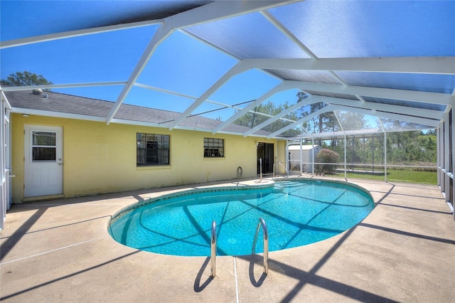 pool with a patio and a lanai