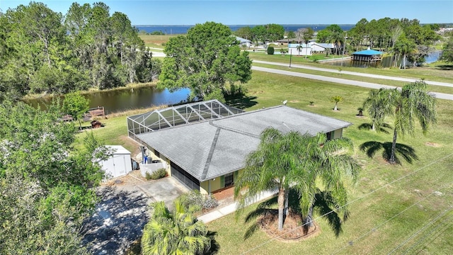 birds eye view of property with a water view