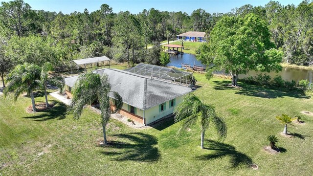 bird's eye view with a forest view and a water view