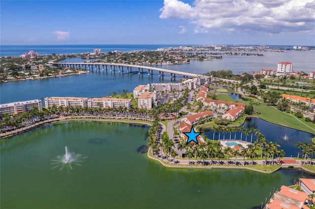 bird's eye view featuring a water view and a city view