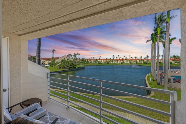 balcony featuring a water view