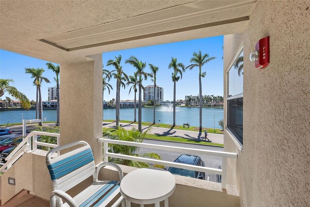 balcony featuring a water view