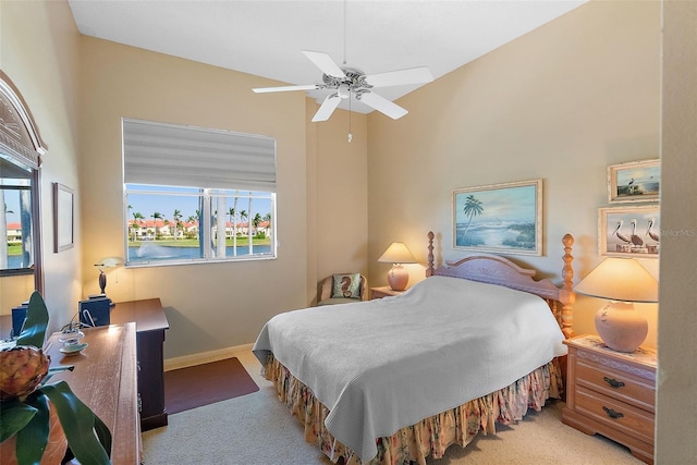 bedroom featuring baseboards, ceiling fan, and carpet flooring