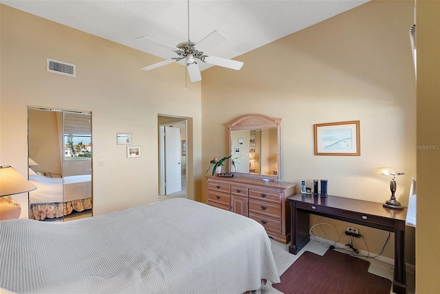 bedroom featuring carpet, visible vents, and high vaulted ceiling