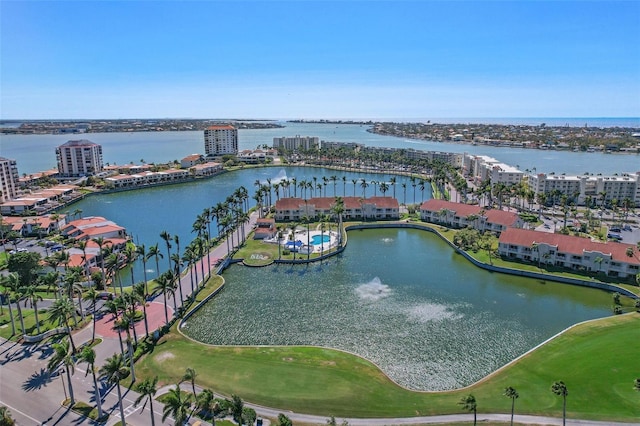 drone / aerial view with a city view and a water view