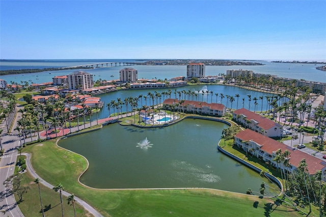 birds eye view of property featuring a view of city and a water view