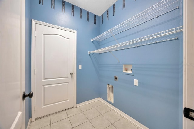 washroom featuring hookup for a washing machine, light tile patterned floors, baseboards, laundry area, and electric dryer hookup