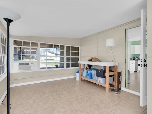 interior space with tile patterned floors, cooling unit, and baseboards