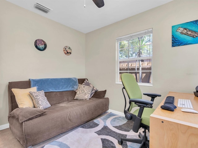 home office featuring visible vents, baseboards, and ceiling fan