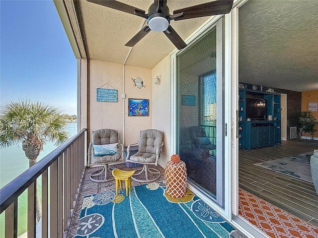 balcony with visible vents and a ceiling fan